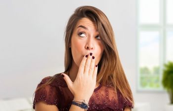 Woman Covering Her Mouth Due to Bad Breath Philadelphia, PA